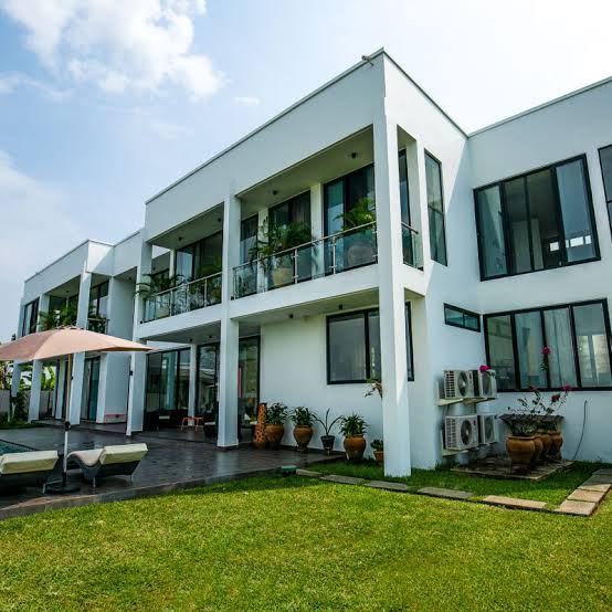 Modern white villa with swimming pool and patio